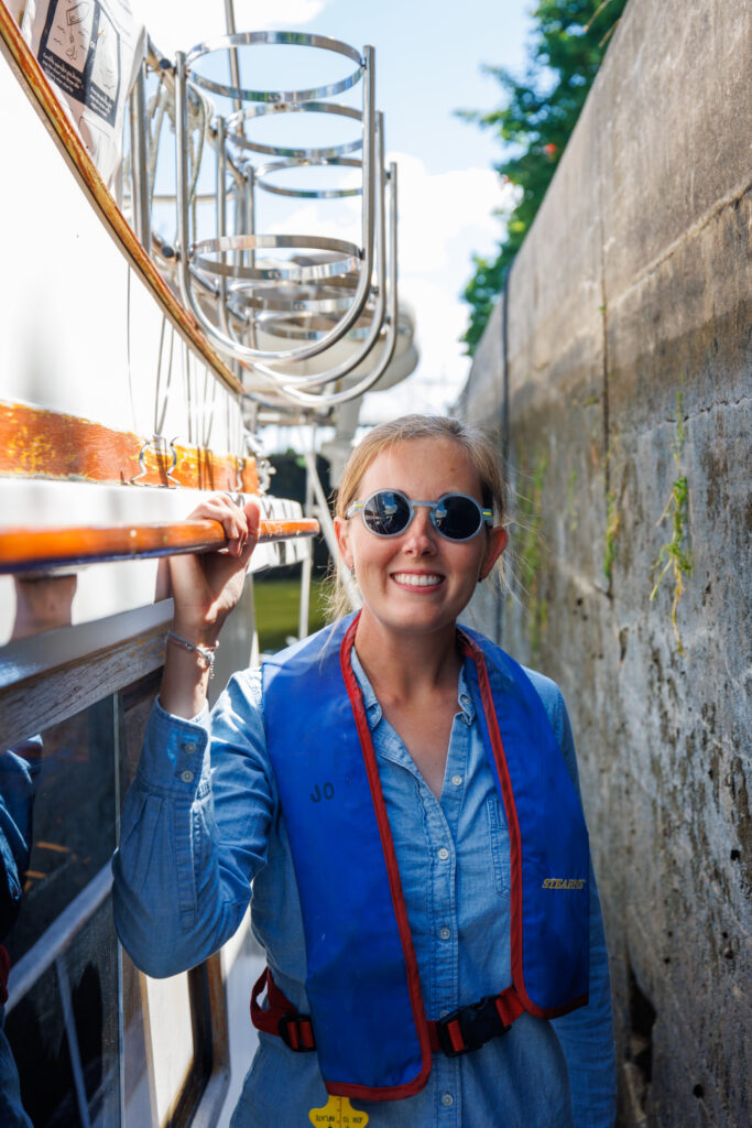 Jenn on the boat in a lock