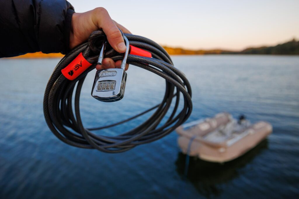 Lock and cord for our dinghy, one of the most important dinghy essentials to keep it safe!