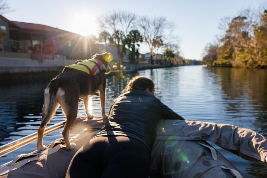 Jen and Ollie on boar our dinghy with all of our dinghy essentials.