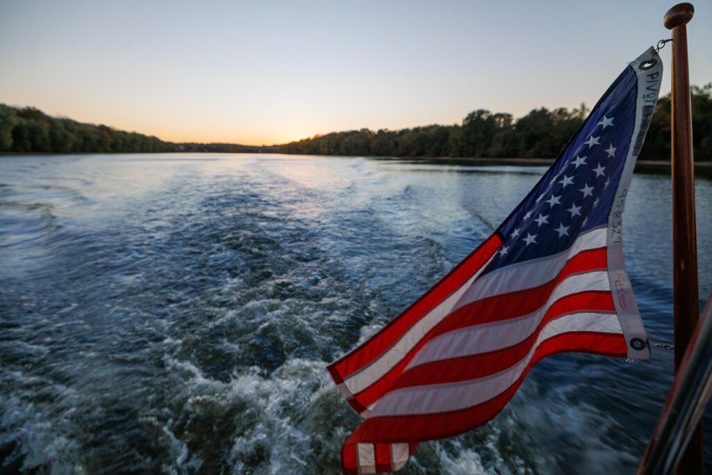 American flag flying on the back of our boat looking out at the Cumberland River during the Nashville Side Trip