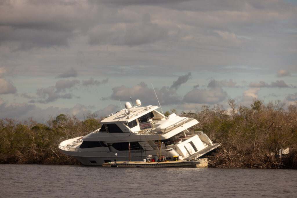 A boat damaged from the hurricane, one of the most dangerous parts of living on a boat