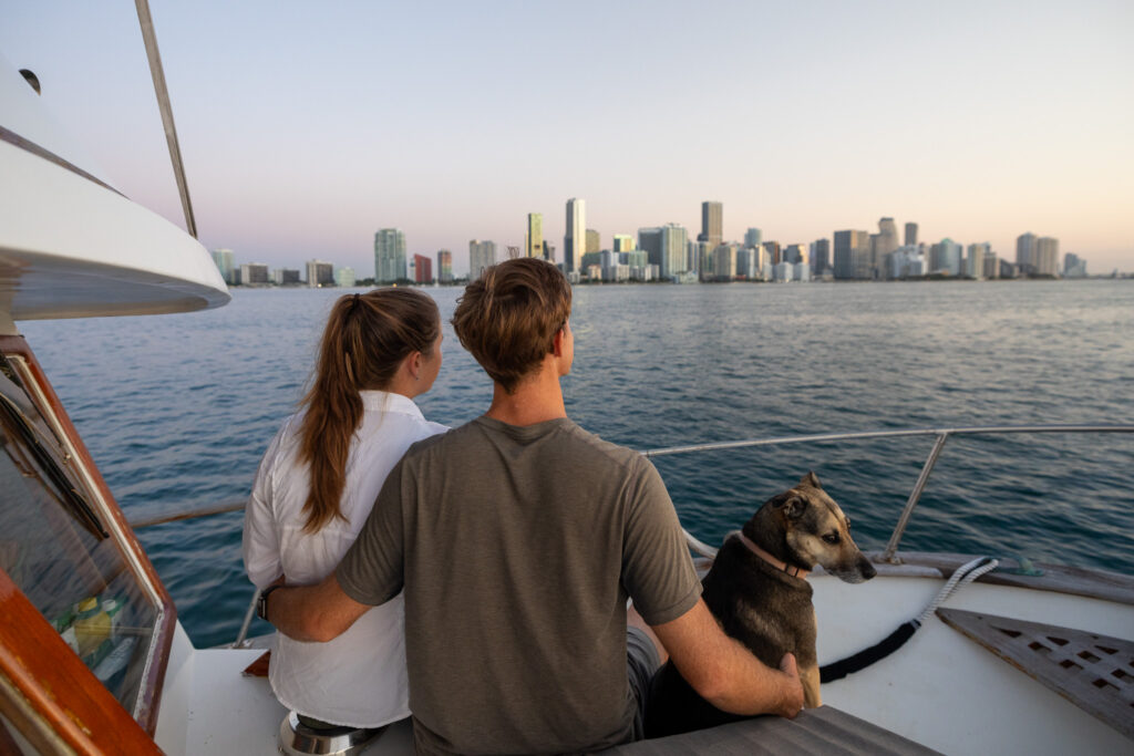 Jen, Elliott and Ollie on the boat looking out over Miami