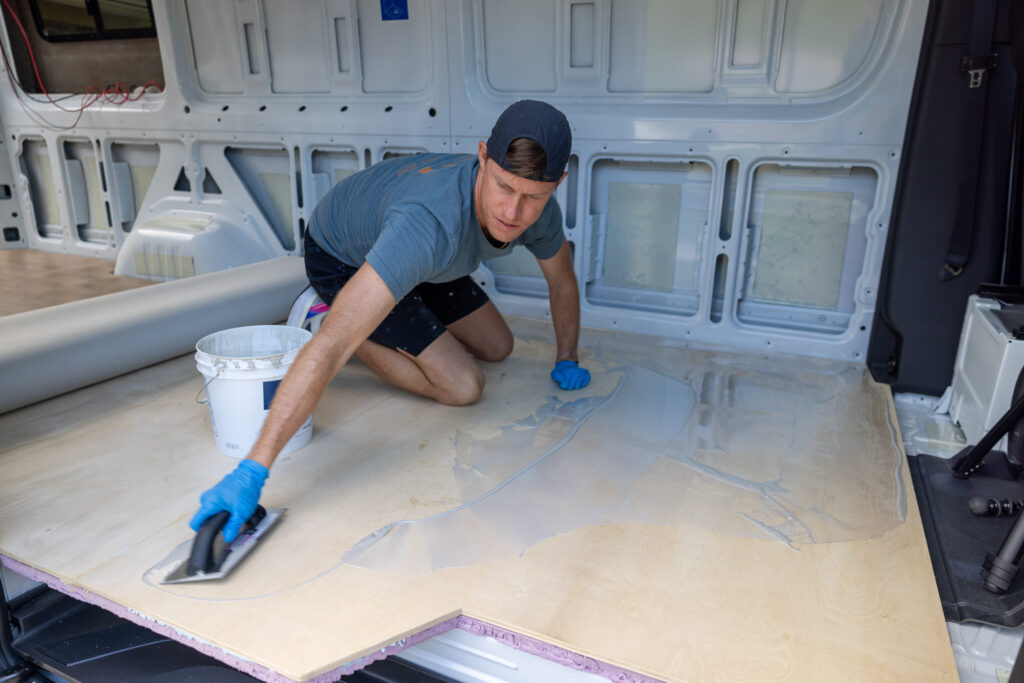 elliot spreading out the epoxy working backwards with a trowel