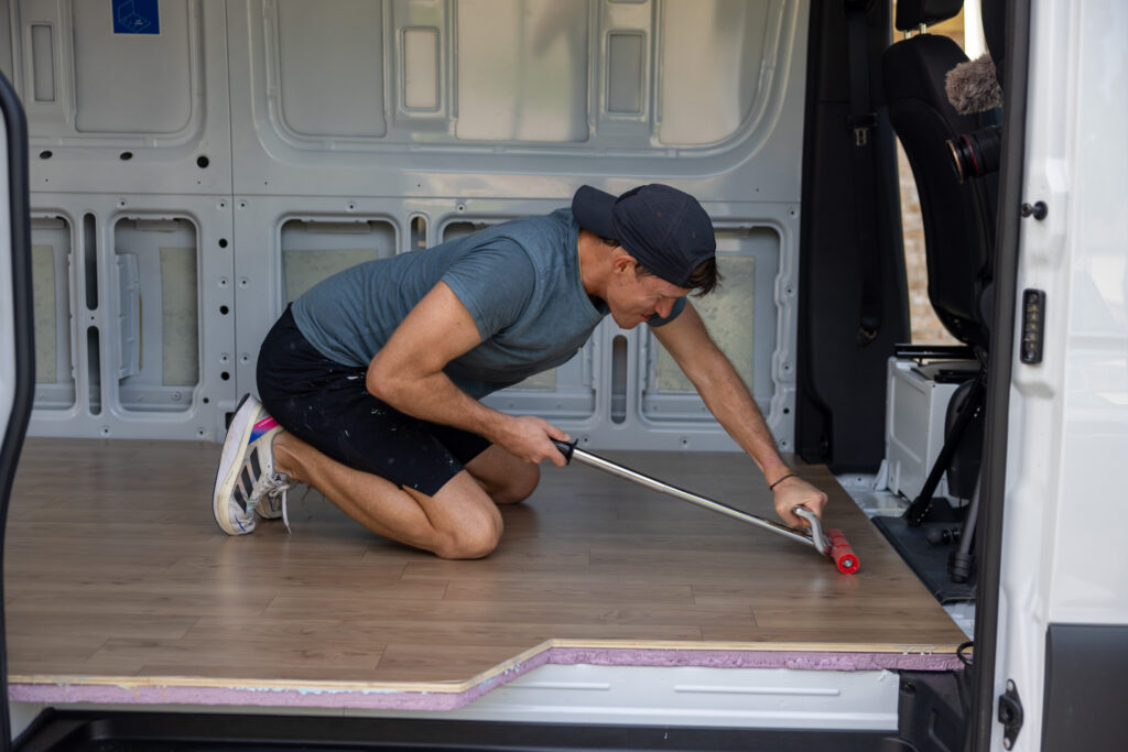 elliot rolling out the camper van floor