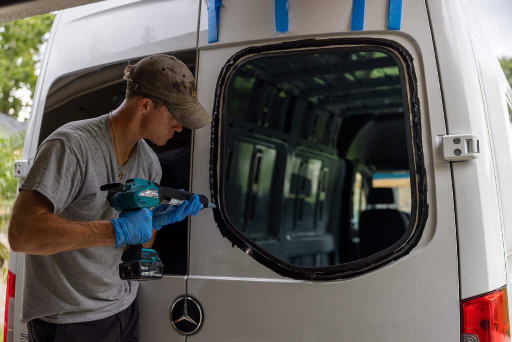 elliot applying caulk close up