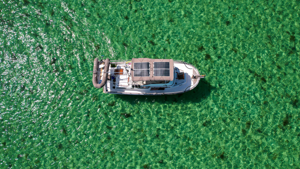 our boat showing four solar panels in the florida keys