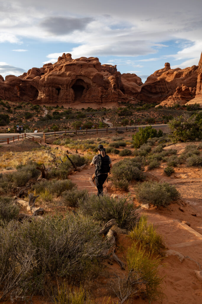 Man walking towards Double Arch